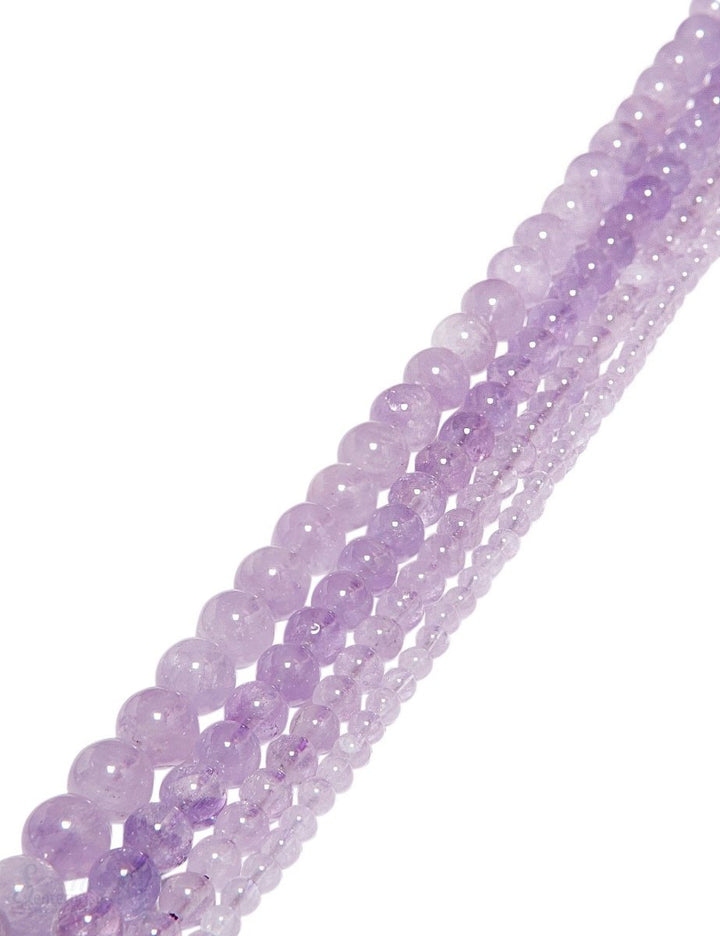 Amethystquarz Strang violett hell poliet Kugeln - Shanti Enterprise AG